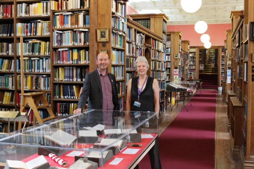 College Librarian James Clements and College Archivist Patricia McGuire waiting to welcome visitors