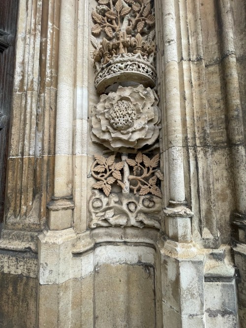 The stonework of the door jamb of the West door of King's College Chapel