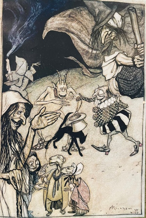 A gathering of witches, goblins and ghouls seemingly having a friendly chat amongst themselves