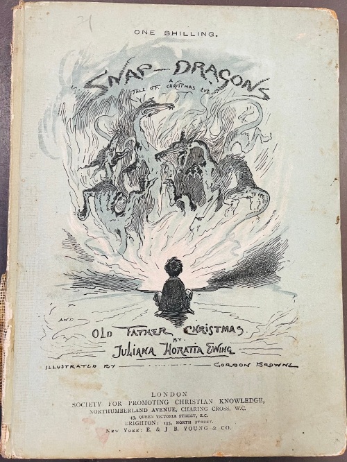Cover of the book showing a boy looking at a swirling group of dragons