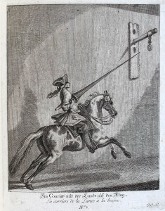a horse with a rider attempting to get his lance in a hanging hoop