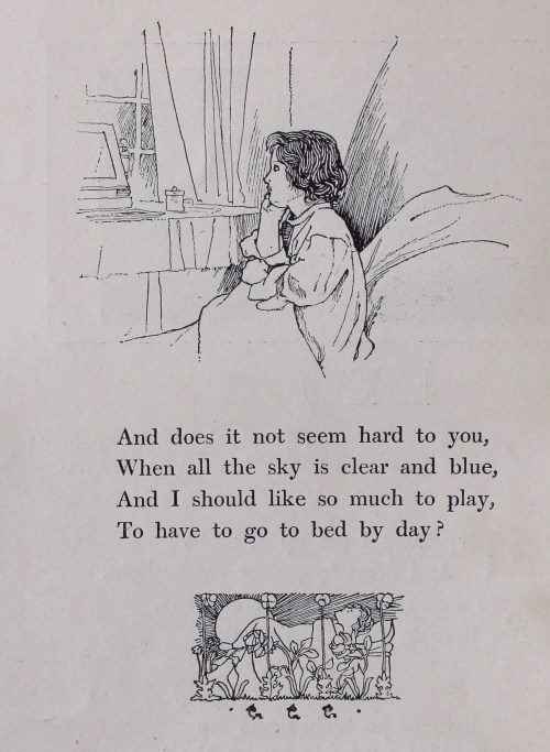 A small girl in bed peering out of the window